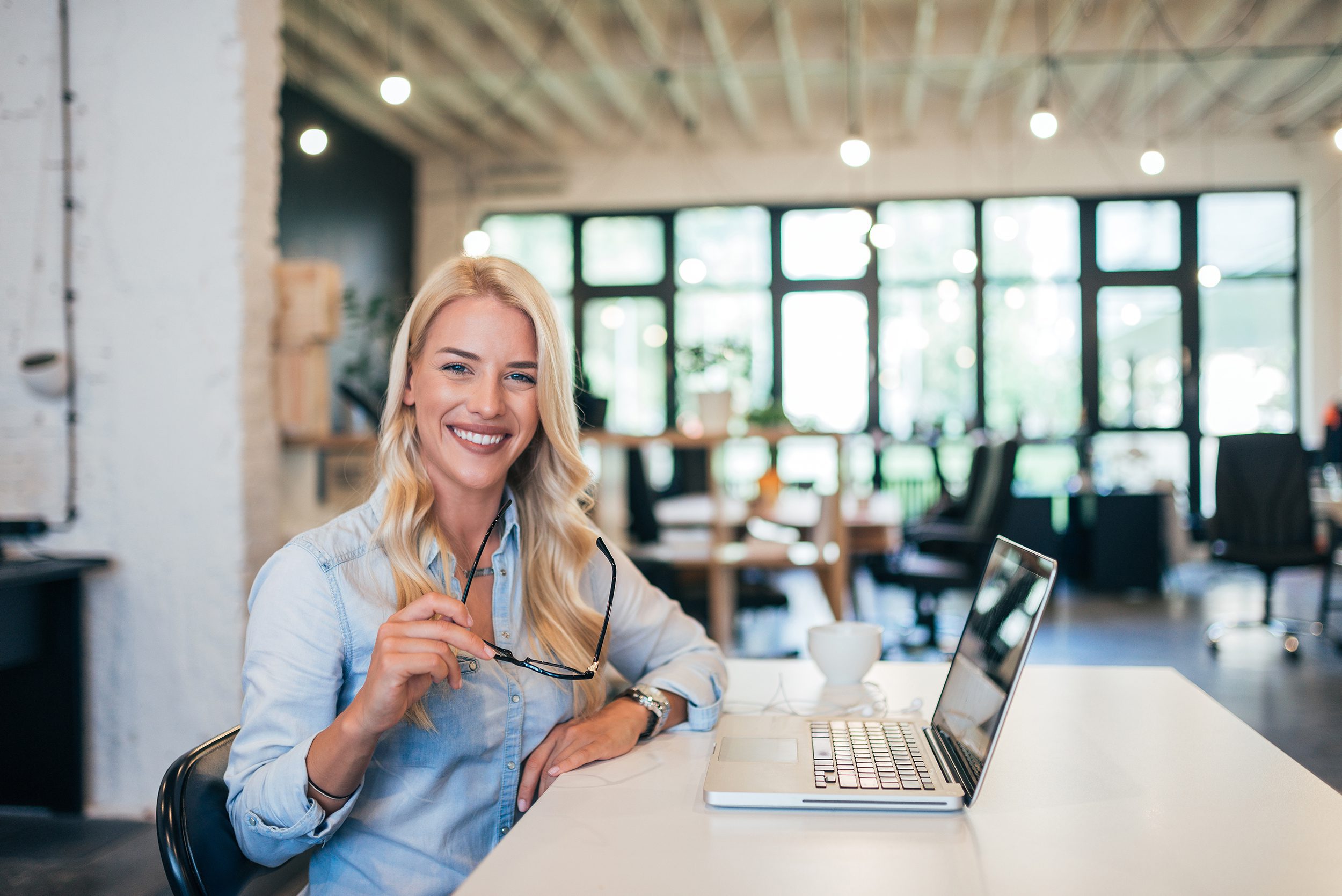 Portrait of a successful female entrepreneur in modern office.