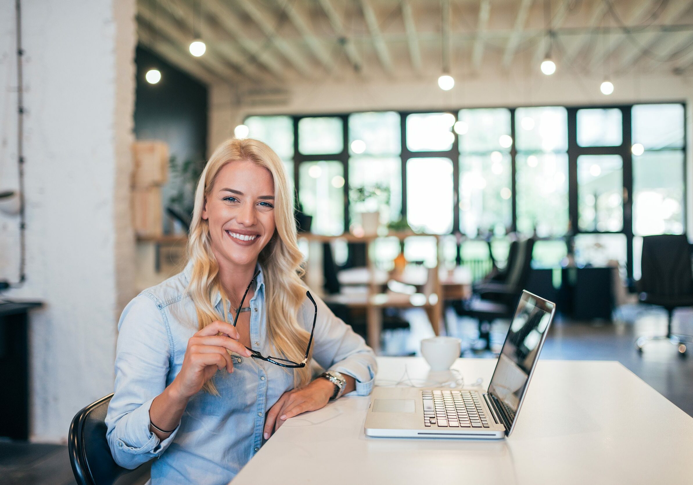 Portrait of a successful female entrepreneur in modern office.